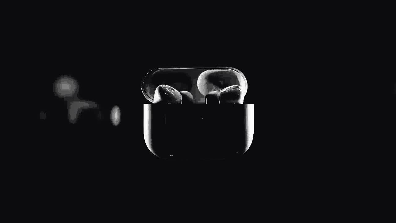 AirPods Pro earbuds against a black background
